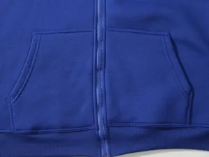 Close-up detail view of royal blue fleece hoodie zipper and front pocket design.
