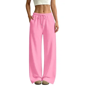 Pink wide-leg casual sweatpants detail showcasing elastic drawstring waist and deep side pockets.
