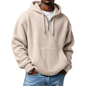 Men's beige waffle knit half-zip hooded sweatshirt with kangaroo pocket, stylish casual streetwear top.