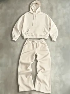 Close-up detail of the beige hooded sweatshirt and wide leg pants lounge set texture.
