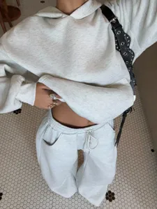 Casual fleece tracksuit for women featuring a cozy hooded sweatshirt and matching sweatpants.