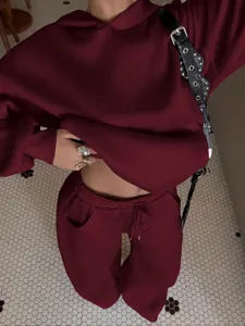 Women fleece tracksuit set casual burgundy hoodie and matching sweatpants streetwear.