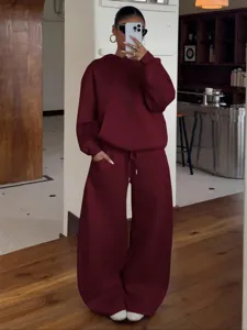 Detail view of the wine red fleece hoodie and wide leg pants tracksuit set, casual indoor look.