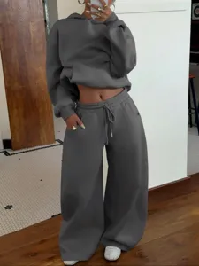 Women dark grey fleece tracksuit set detail, casual oversized hoodie and wide leg sweatpants.