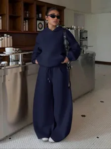 Women fleece hoodie and wide-leg sweatpants set, casual street style tracksuit detail.
