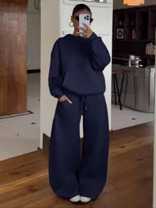 Women fleece tracksuit set oversized hoodie and wide leg sweatpants casual streetwear style.