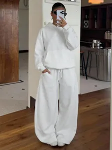 Detail shot of women casual white fleece hoodie and wide leg sweatpants lounge set.