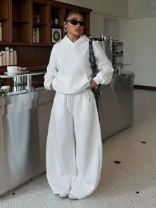 White fleece hoodie and wide leg sweatpants set, comfortable streetwear two piece outfit for women.