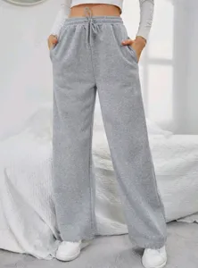 Detail view of casual grey fleece-lined sweatpants for women with comfortable drawstring.