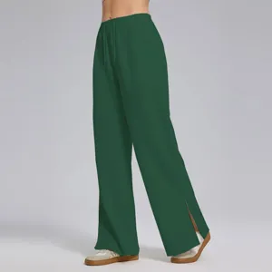 Pantalón de chándal ancho verde oscuro detalle con abertura lateral en el dobladillo.
