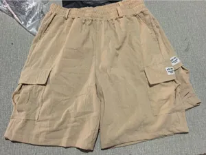 Detail view of men's casual cotton linen cargo shorts with multi-pockets and drawstring waist.
