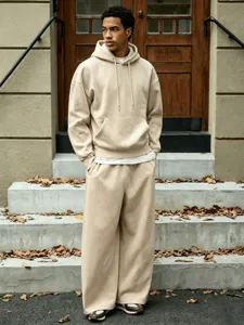 Men's casual fleece-lined hoodie and wide-leg pants two-piece set, khaki relaxed streetwear detail view.