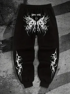 Vista detallada del pantalon de chandal negro estampado gotico Y2K con grafico tribal.