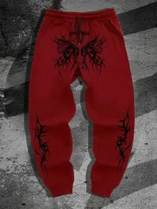 Pantalón de chándal rojo gráfico gótico Y2K detalle, ancho streetwear casual.