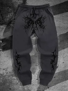 Pantalones de chándal holgados con estampado gótico oscuro Y2K streetwear detalle.