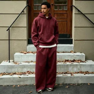 Men's casual fleece tracksuit hoodie and wide leg trousers set solid color streetwear.