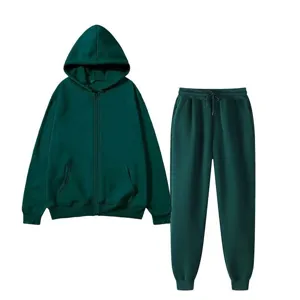 Close-up detail of dark green fleece zip hoodie and sweatpants tracksuit set fabric texture.