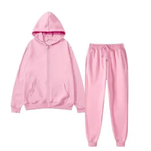 Detailed shot of the pink fleece zip hoodie and matching sweatpants set texture fabric features.