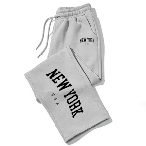 Grey drawstring sweatpants featuring a stylish New York letter print, casual loose Y2K streetwear fit.