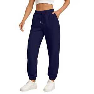 Detail view of casual dark blue sweatpants with elastic drawstring waistband and comfortable fit.