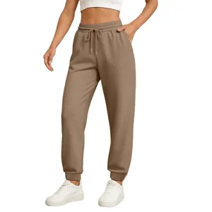 Comfortable khaki sweatpants featuring an adjustable drawstring waist and relaxed cuffed legs.