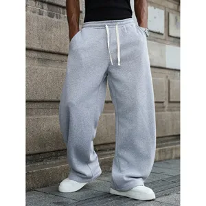 Men's casual loose fit drawstring sweatpants wide leg streetwear style detailed shot.