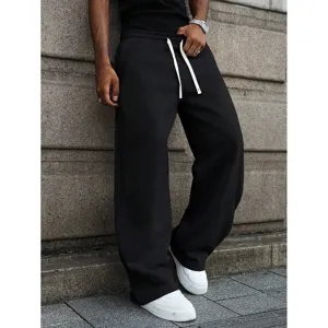 Casual loose black sweatpants for men with white drawstrings, comfortable wide leg trousers.