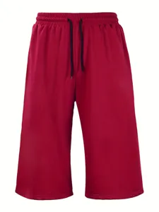 Detail view of loose wide-leg casual shorts for men, featuring solid color and elastic drawstring.