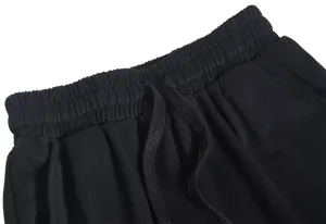 Men's casual black shorts detail featuring comfortable elastic waistband and adjustable drawstring.