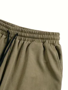 Close up view of the elastic waistband and black drawstring on casual khaki shorts detail