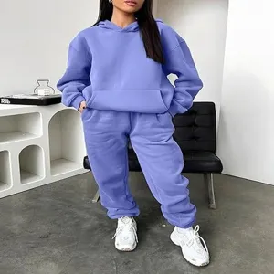 Close-up detail of casual purple hoodie and sweatpants two-piece Y2K tracksuit set for women.