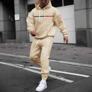 Men's casual hoodie and sweatpants tracksuit set in solid beige with stylish lettering.