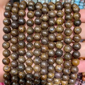 Detail of natural brown agate beads showing unique wood-like texture and glossy finish.