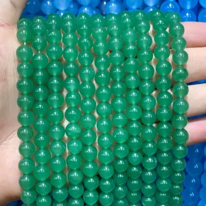 Close-up of translucent green natural chalcedony agate round beads for DIY jewelry
