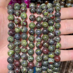 Detailed macro view of natural dragon blood jasper round stone beads for DIY jewelry making