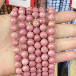Detailed macro view of natural pink marbled stone beads for DIY jewelry and bracelets