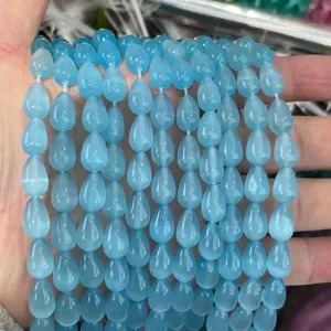 Detailed view of sky blue 8x12mm waterdrop cat's eye loose beads for DIY jewelry.