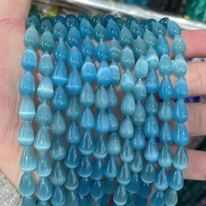 Close-up of 8*12mm blue teardrop cat's eye glass beads with smooth polished finish