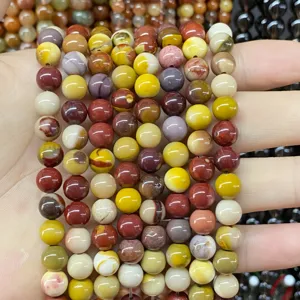 Detailed view of multi-colored natural agate jasper round beads for DIY bracelet making
