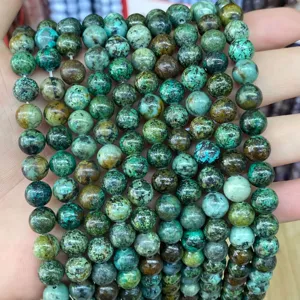 Close-up detail showing the natural textures of green stone round beads for DIY jewelry