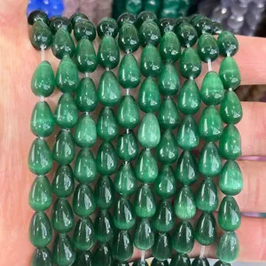 Close-up of 8x12mm green cat-eye teardrop beads for jewelry making