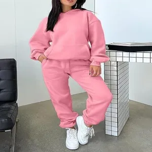 Women pink casual 2-piece hoodie sweatshirt and sweatpants tracksuit set for autumn season.