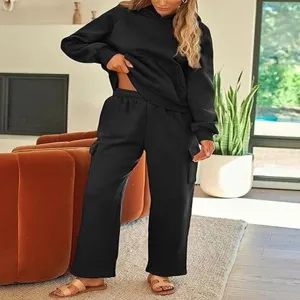 Women two piece tracksuit set casual black hoodie and cargo sweatpants for autumn fashion wear.