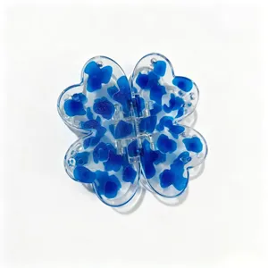 Transparent blue four-leaf clover hair claw clip with lovely spot pattern for daily hair styling.