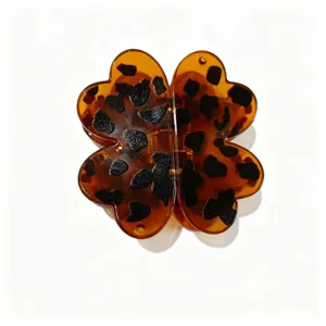 Tortoise shell four leaf clover hair claw clip for women, stylish daily hair styling accessory.
