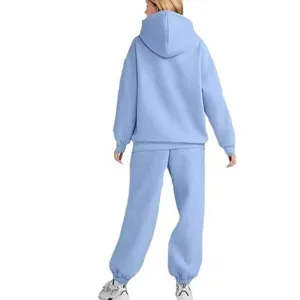 Casual fleece hooded sweatshirt and sweatpants matching tracksuit in light blue color.