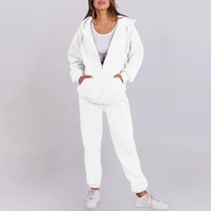 Cozy white fleece-lined zip hoodie and sweatpants detail view, soft casual wear texture.