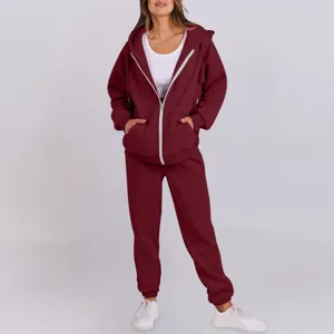 Detailed view of women's casual burgundy zip hoodie and comfortable tracksuit set.