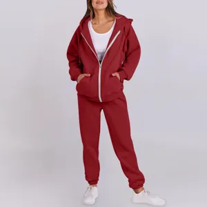 Detailed shot of casual red zip-up hoodie and sweatpants set, comfortable autumn fit.