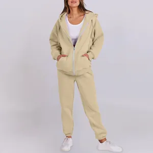 Beige fleece-lined zip hoodie and sweatpants set detail showcasing soft fabric and cozy fit.